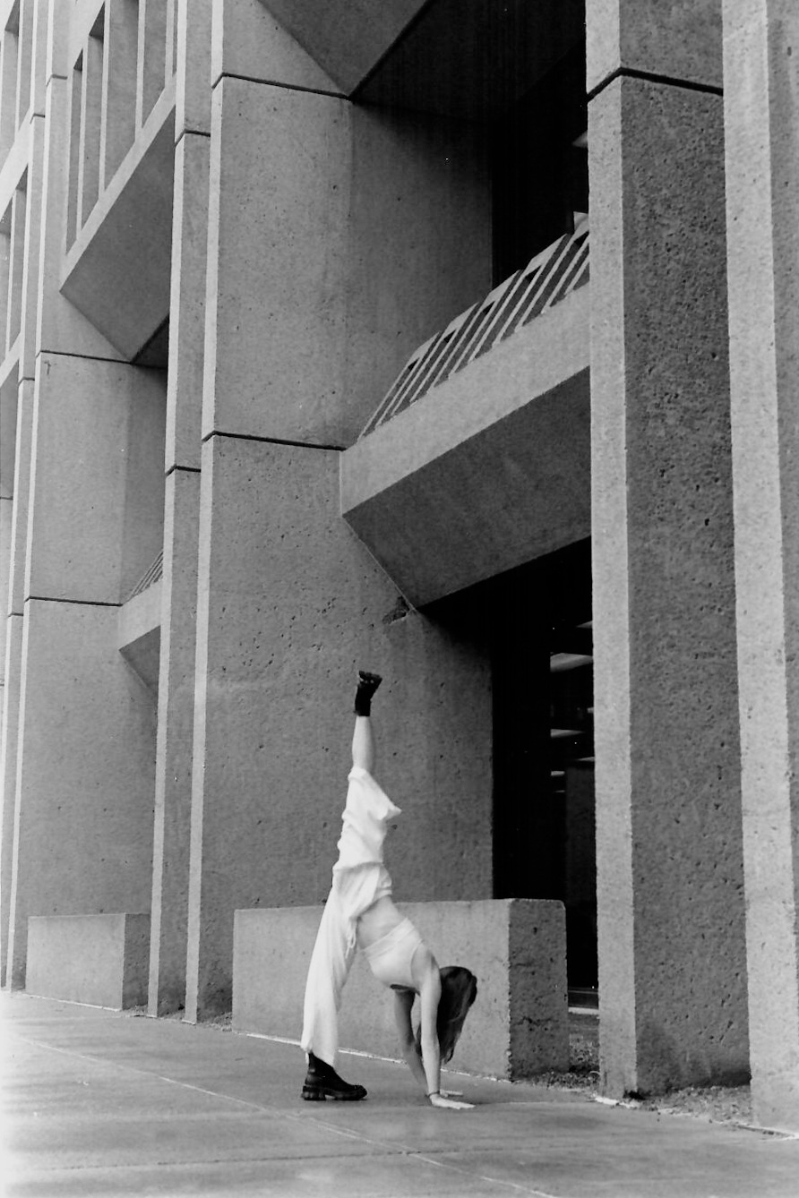 Lines of a dancer's body and lines of a building
